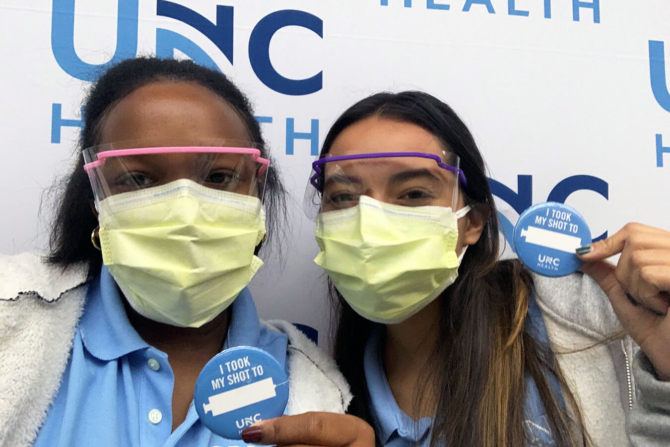 Scholars Bria Bryant and Rebecca Zasloff volunteered at the Friday Center vaccine clinic.